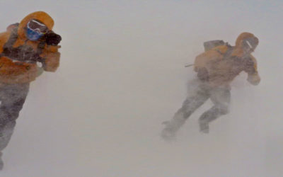 People walking through a blizzard