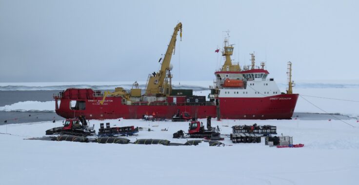A boat that is sitting in the snow