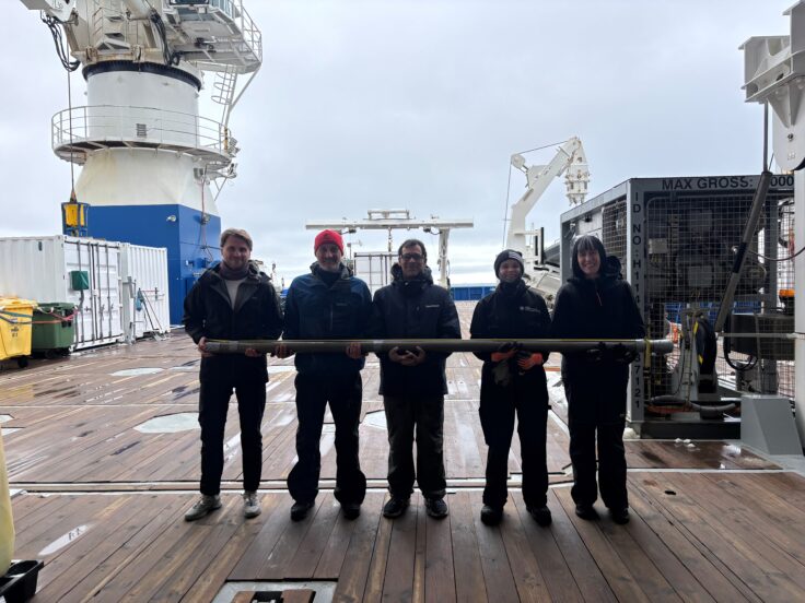 A group of people standing on a dock